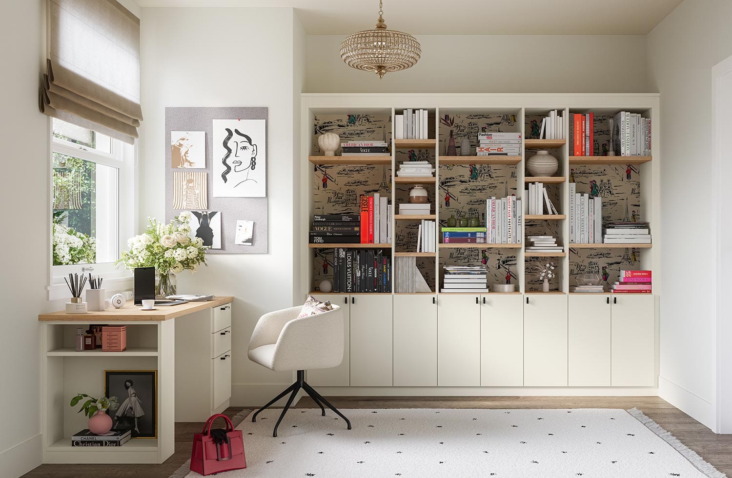 A home office customized with built in bookshelves and cabinet organization by California Closets