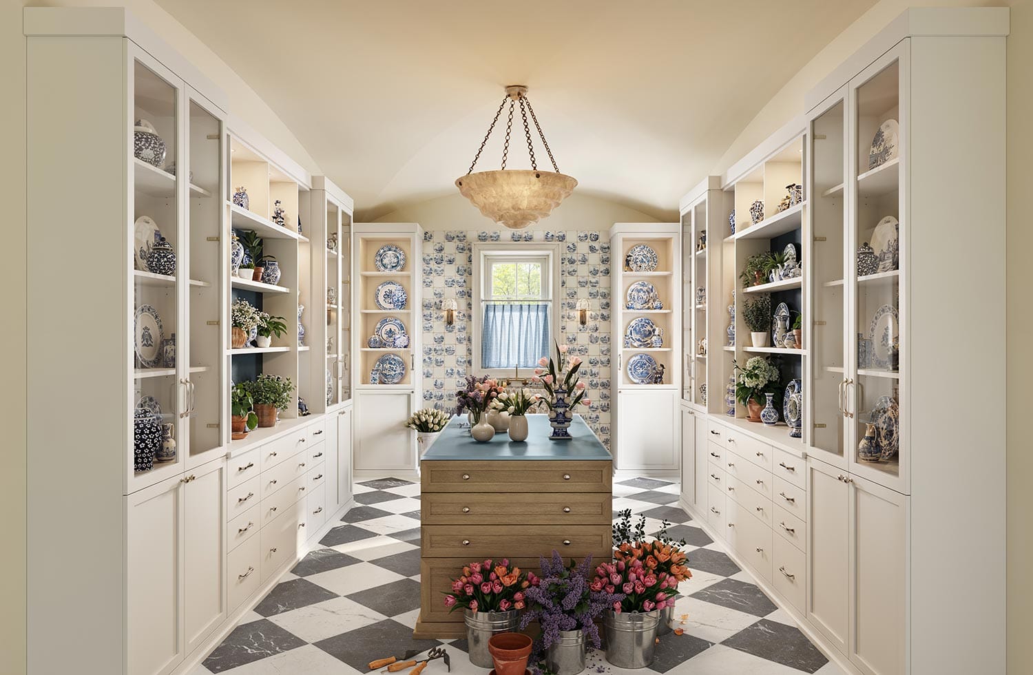 Customized large kitchen pantry room with built in hutch drawers by California Closets
